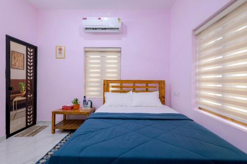 Bluebell Shores -Cozy Stay Near Varkala Beach 객실 침대