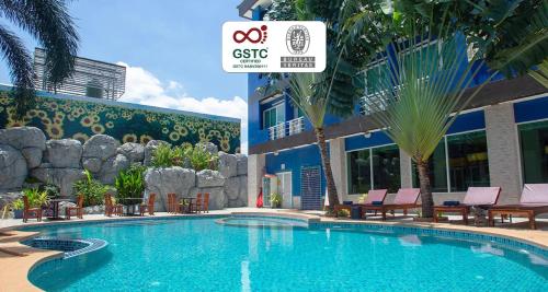 a swimming pool in front of a building at Best Western Royal Buriram in Buriram