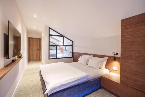 Ένα ή περισσότερα κρεβάτια σε δωμάτιο στο Istros luxury house