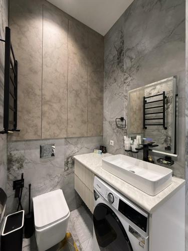 Ένα μπάνιο στο Cozy Nest Apartments