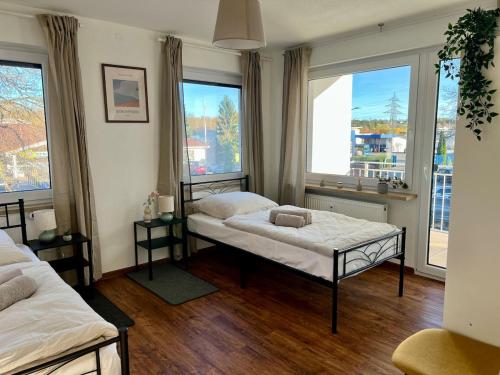 Postel nebo postele na pokoji v ubytování Cozy & Stil Apartment III bis 8 Personen VS