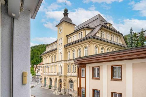 a large building with a clock tower on top of it at St Moritz Square 2 bedr Alpin Elegance in St. Moritz