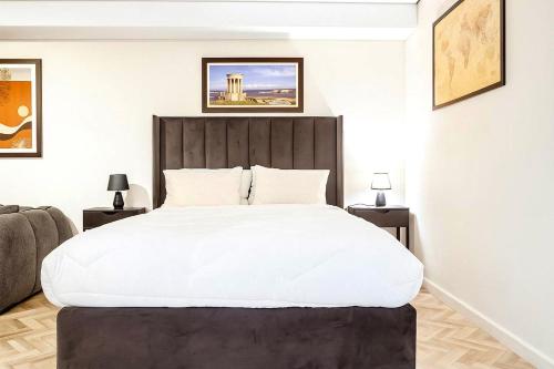 Postel nebo postele na pokoji v ubytování City Centre Oasis