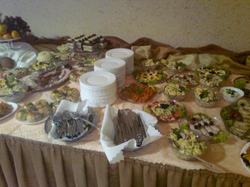 a table with many different types of food on it at Jawor in Polańczyk