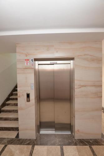 a elevator in a building with a staircase at Arti̇m Apart Hotel in Fethiye