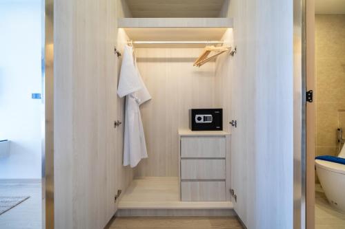 a bathroom with a walk in shower next to a toilet at Ozone Condominium BangTao Laguna Area in Phuket