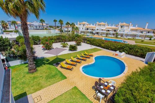 an aerial view of a resort with a swimming pool at Villa Hope by Villa Plus in Galé