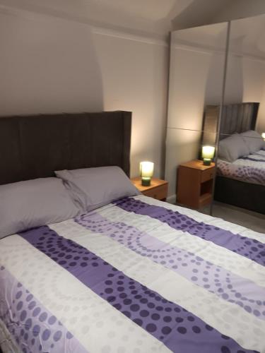 Ένα ή περισσότερα κρεβάτια σε δωμάτιο στο High Class Accommodations 30