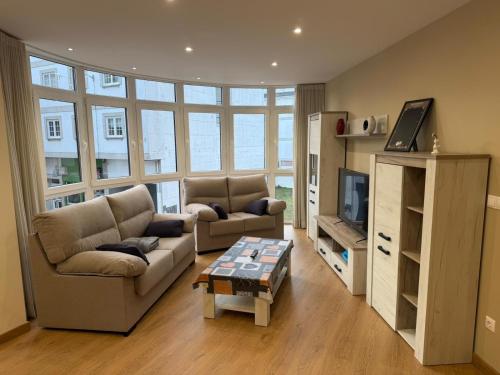 TV a/nebo společenská místnost v ubytování Cortiñas