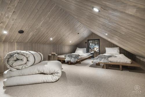 Postel nebo postele na pokoji v ubytování North Suite Nova by Hilla Villas