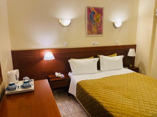 Posteľ alebo postele v izbe v ubytovaní Triton Hotel Piraeus