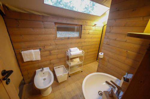 a small bathroom with a sink and a toilet at Glamping Poggio Nardini in Montelupo Fiorentino