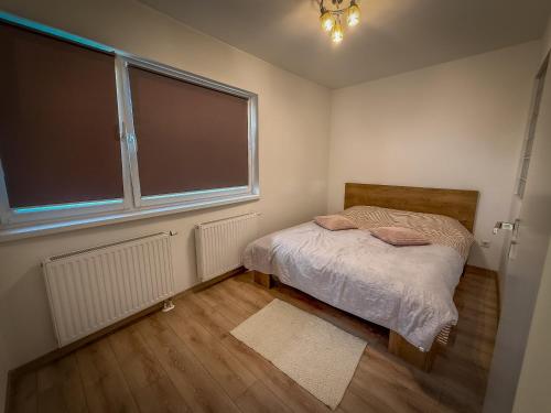 Postel nebo postele na pokoji v ubytování Yvett Studio-Fortuna Park