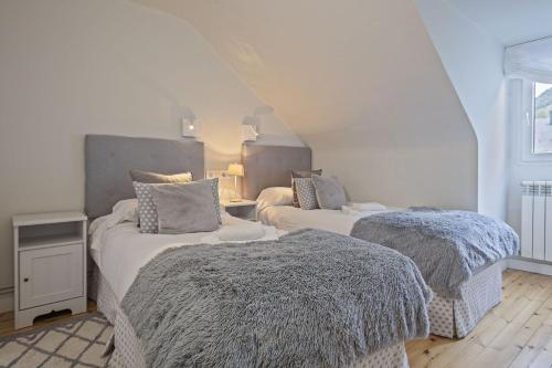 Ένα ή περισσότερα κρεβάτια σε δωμάτιο στο Luderna - Apartamento Era Aigueta