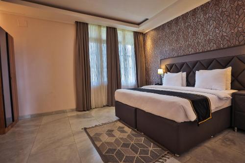 Ένα ή περισσότερα κρεβάτια σε δωμάτιο στο Homefree Hotel by signature