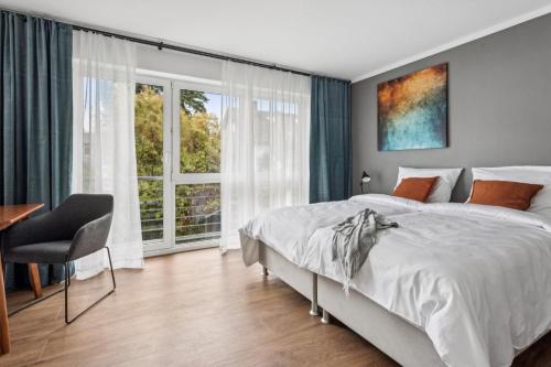 Ένα ή περισσότερα κρεβάτια σε δωμάτιο στο Charmantes Stadthaus, Parkplätze, Garten