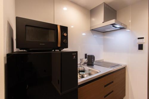 Η κουζίνα ή μικρή κουζίνα στο Tabi and -light- 博多01