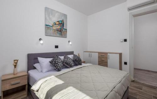 a bedroom with a large bed with pillows on it at Villa Lemily with private pool by Villas Guide in Lipa