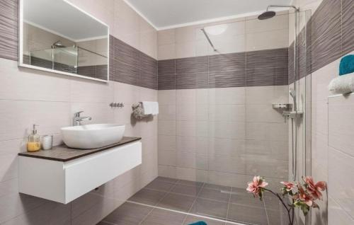 a bathroom with a sink and a shower at Villa Lemily with private pool by Villas Guide in Lipa