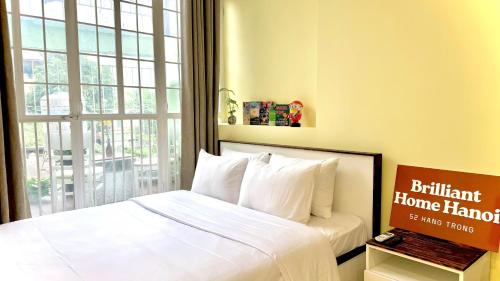 Ένα ή περισσότερα κρεβάτια σε δωμάτιο στο Hanoi Brilliant Home