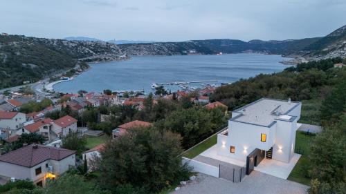 an aerial view of a house next to a body of water at Villa Adria Blue in Bakarac