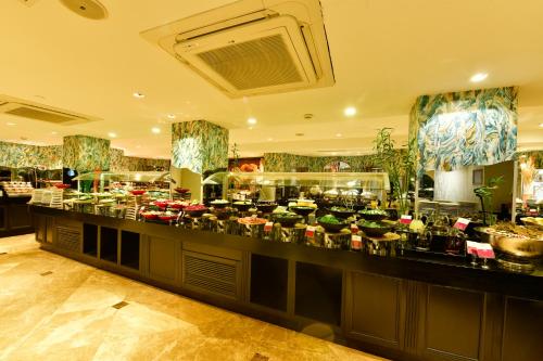 a restaurant with a counter with a lot of food at Crowne Plaza Istanbul - Old City by IHG in Istanbul