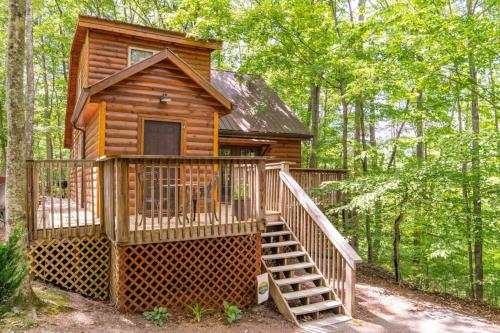 a cabin in the woods with a staircase leading up to it at Gorgeous View Cabin - in Red River Gorge KY in Slade