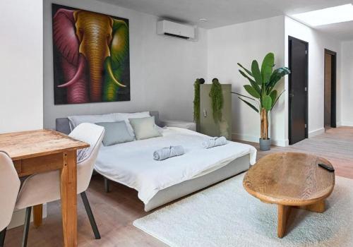 a living room with a bed and a table at The Vault - Eindhoven - By T&S in Eindhoven