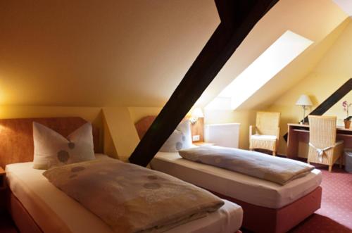 Hotel Perler Hof tesisinde bir odada yatak veya yataklar