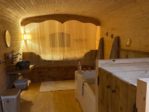 a bathroom with a sink and a washing machine at La champ être in Neuville-sur-Sarthe