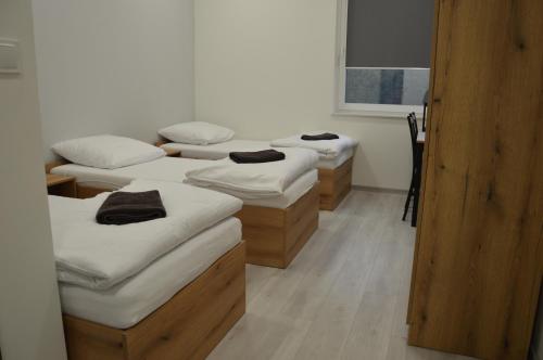 three mattresses lined up in a row in a room at Ośrodek Sportu i Rekreacji w Janowcu Wielkopolskim in Janowiec Wielkopolski