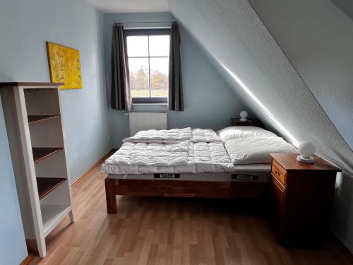 Postel nebo postele na pokoji v ubytování Ferien unterm Reet