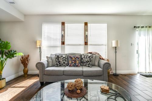 a living room with a couch and a glass table at Fabulous & Stylish 4BR w Pool Table and Space to Chill in Houston