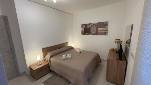 Una cama o camas en una habitación de Vito's House