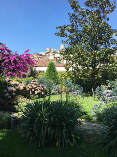 a garden with flowers and plants in a yard at Il Casale di Riardo Luxury B&B in Riardo