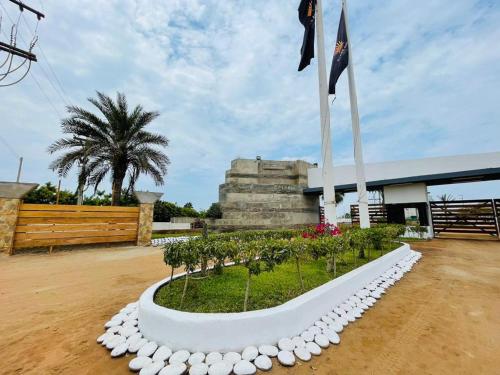 a flag pole in front of a building at Beach House - Private Dock and Pool in Cerro Azul
