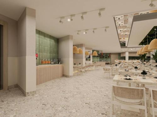 a restaurant with tables and chairs in a room at Annabella Park Hotel - All Inclusive in Avsallar