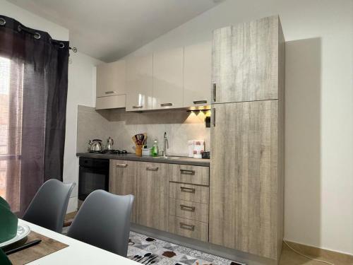 Kuchyň nebo kuchyňský kout v ubytování Pausania Luxury Ferrini Apartment