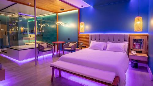 Ένα ή περισσότερα κρεβάτια σε δωμάτιο στο Liv Motel Ecuador