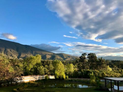 a view of a road with mountains in the background at Hacienda Cascanueces in Villa de Leyva