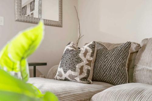 a couch with pillows on it in a living room at Golf Course View at the Foothills Resort in Branson