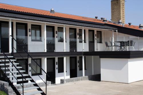 an exterior view of a house with a balcony at A Hotels Roskilde in Hedehusene