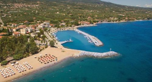 an aerial view of a beach with boats in the water at Dimitra's Apartment in Petalidhion