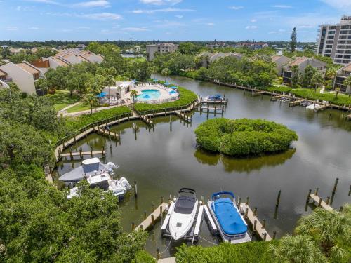 an aerial view of a marina with boats in the water at Midnight Cove II 117F in Siesta Key