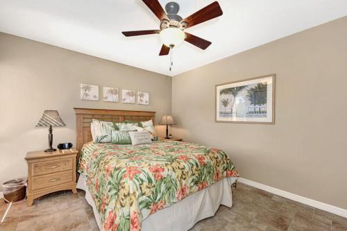 a bedroom with a bed and a ceiling fan at Midnight Cove II 134F in Siesta Key