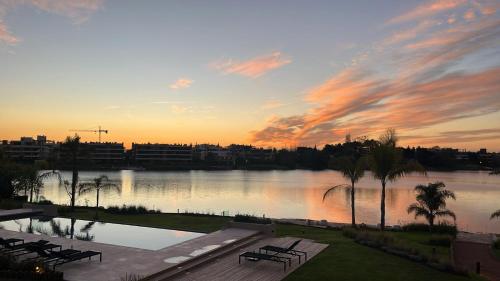 a view of a body of water at sunset at Edificio Lawa Calyptus in Montevideo