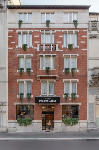 an apartment building on a city street at Palazzo Buenos Aires in Milan