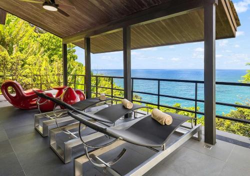 a gym with a view of the ocean at Villa Yin-Noi, Private Oceanfront Villa, Kamala Beach in Kamala Beach