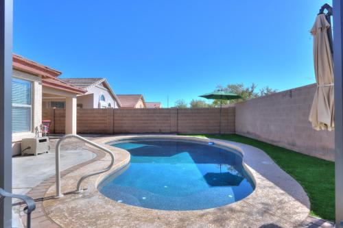 a swimming pool in the backyard of a house at Private Mini Serene Oasis with Pool in Maricopa