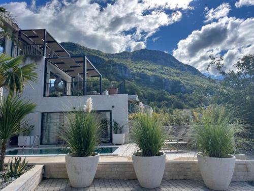 a house with a view of a mountain at Vila panorama in Budva